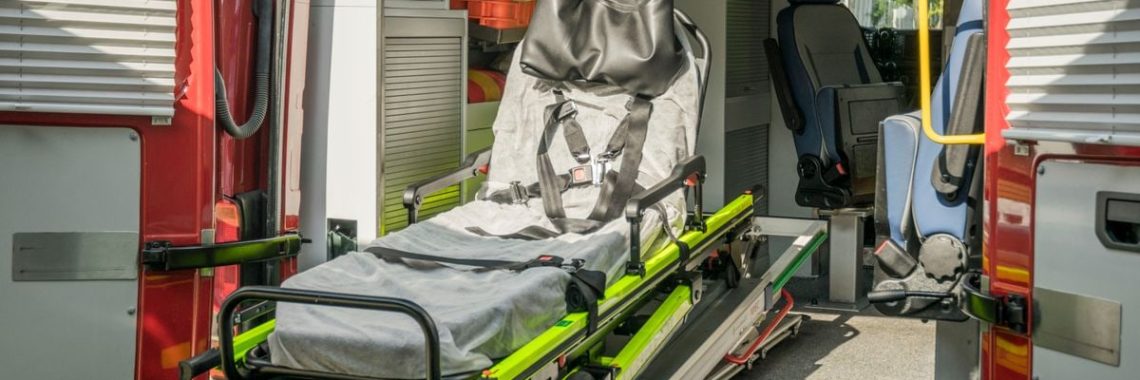 Inside view of a modern emergency ambulance showing a stretcher for patient transport.